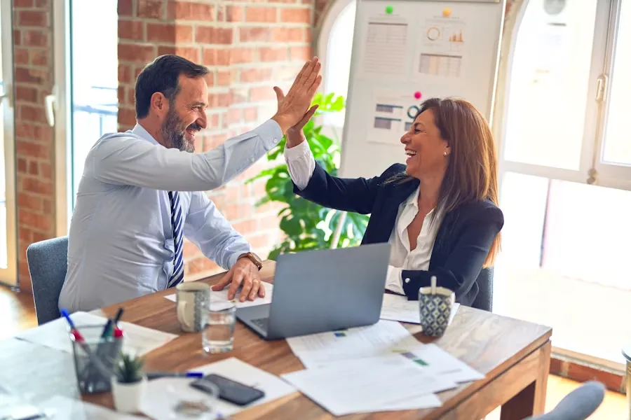 eCommerce specialists reviewing store performance data with a client