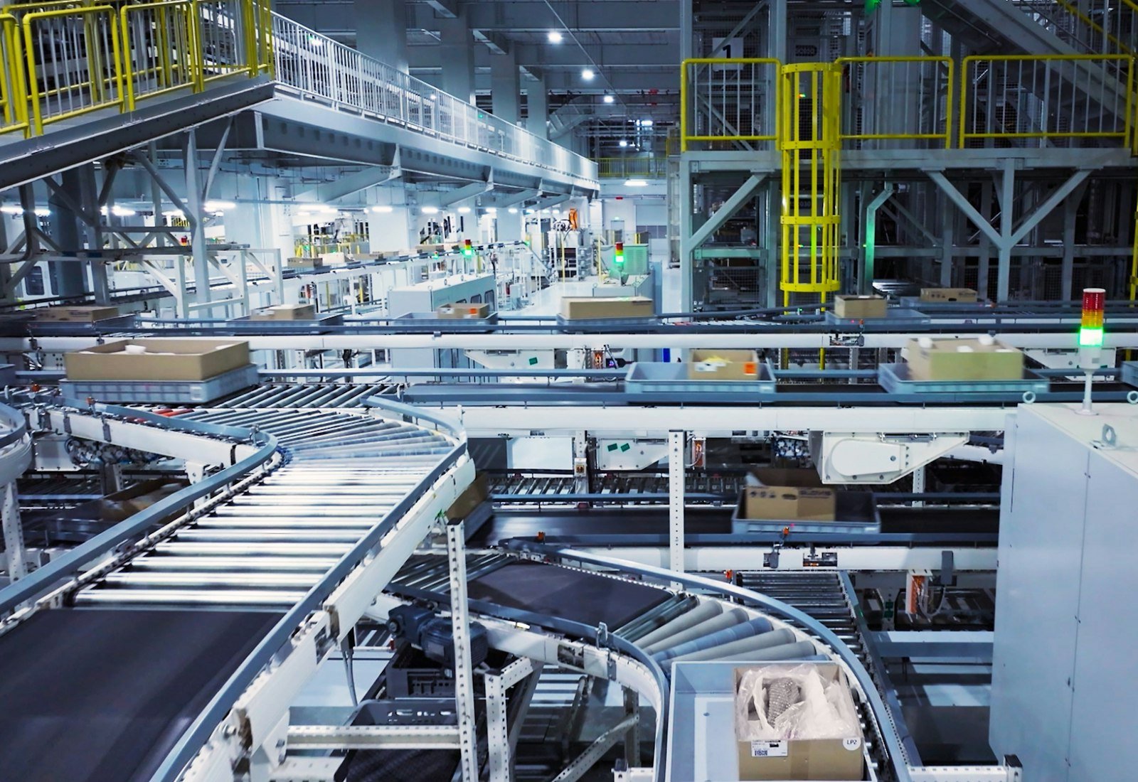 Factory floor with machinery and stacked boxes