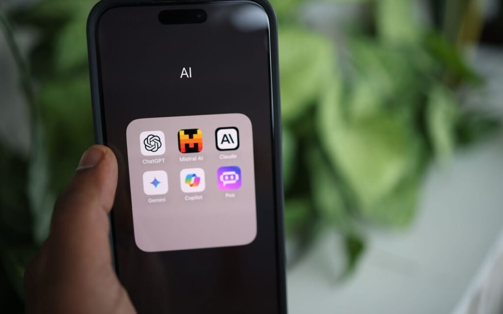 Hand holding a smartphone showing an AI assistant used to research product recommendations