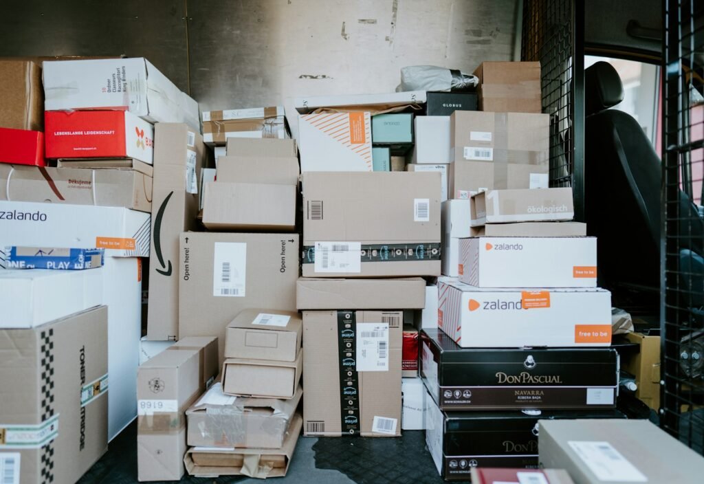 Cardboard shipping boxes stacked in a delivery van