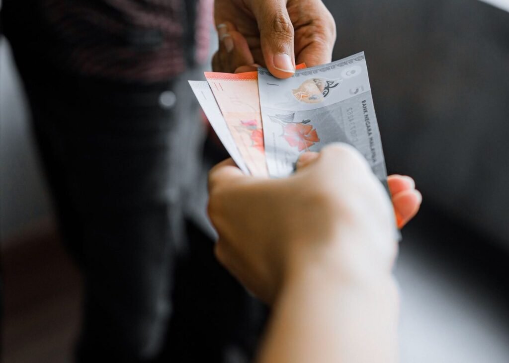 Local currency notes being exchanged in an Asian market