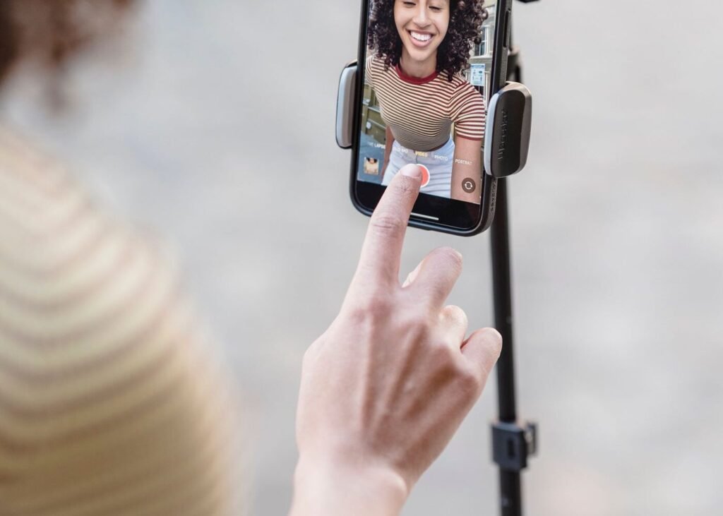 Seller recording a live shopping video on a smartphone
