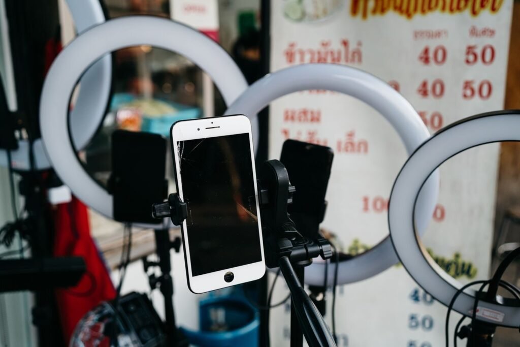 Smartphone on a tripod with ring lights set up for live selling