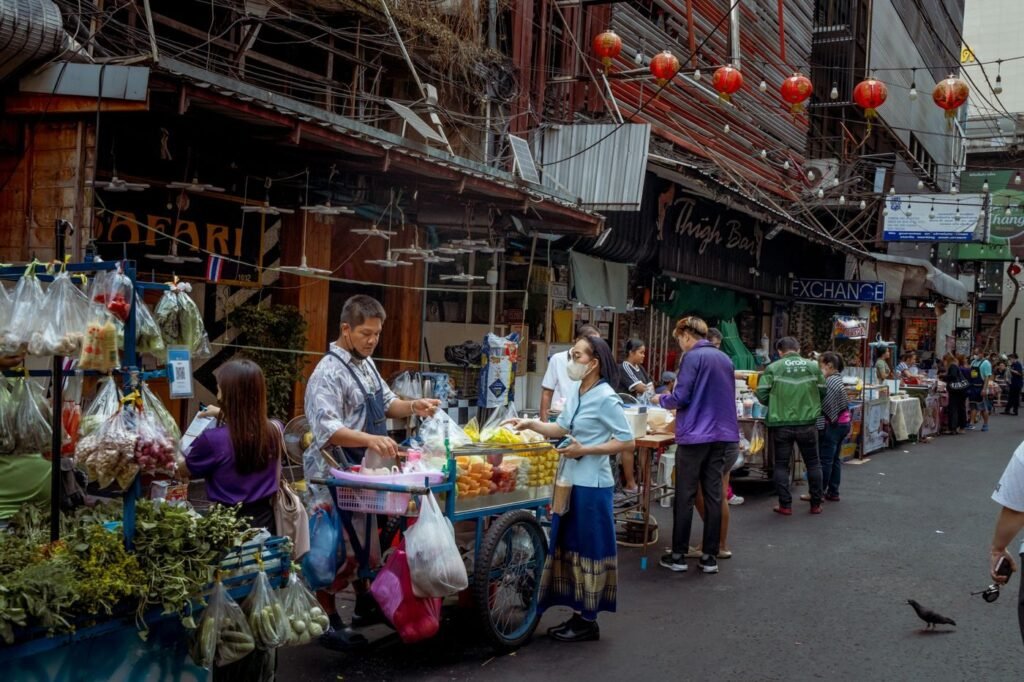 Vendors trading at a bustling Asian street market