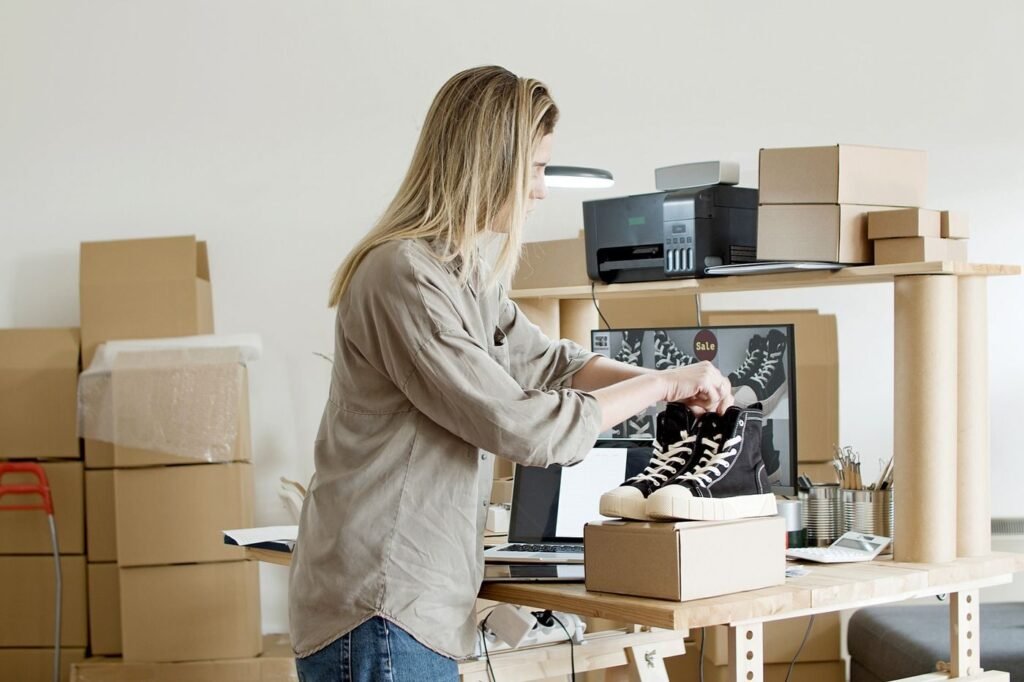 Business owner packing footwear for an online order