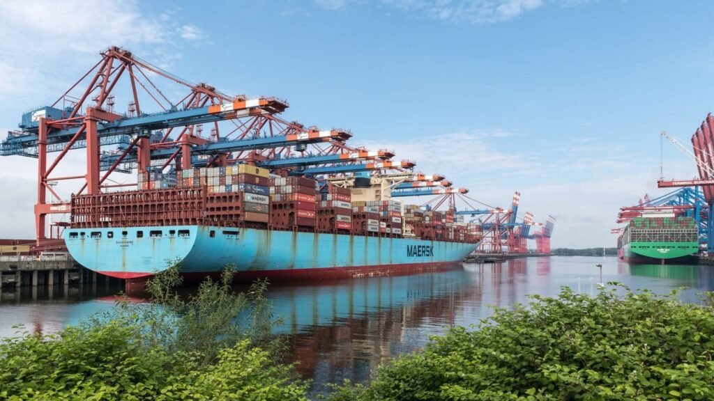 Urban harbour with cargo ships at berth