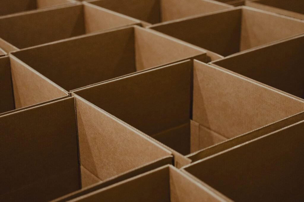 Rows of open cardboard boxes ready for packing