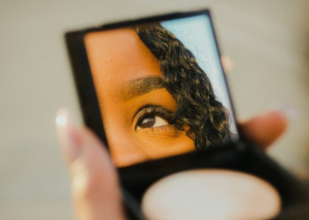 Beauty shopper holding an open compact