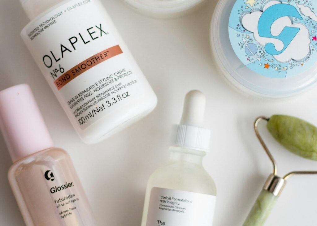 Three skincare products arranged on a white table