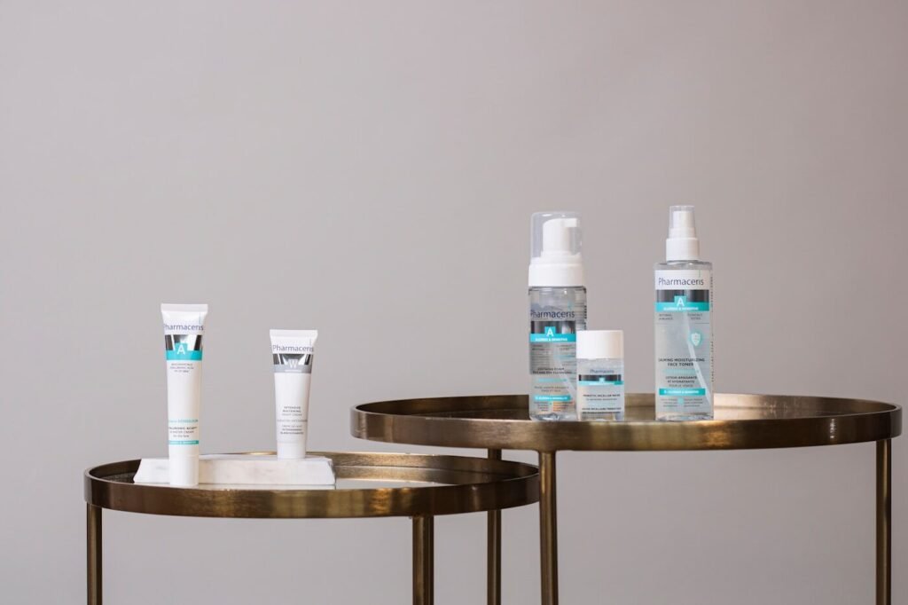 White and blue skincare bottles on a table