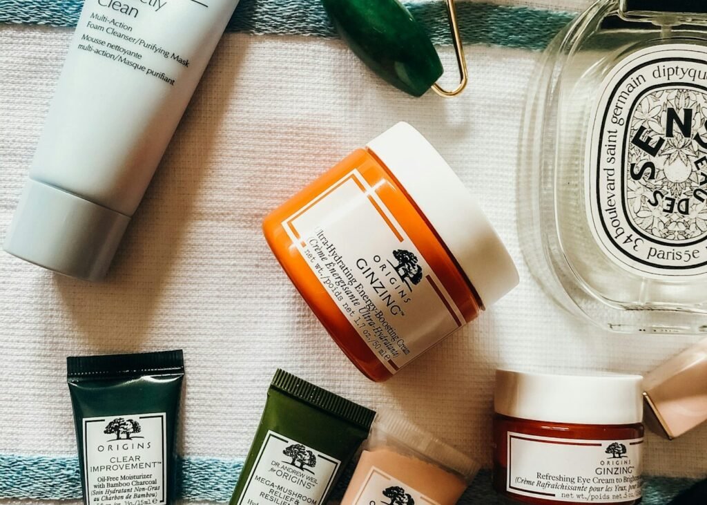 Skincare products and a jade roller laid out as a daily routine