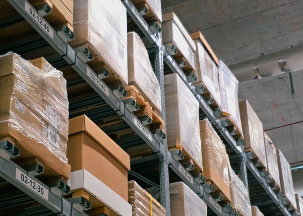 Warehouse storage with stacked cardboard boxes ready for marketplace orders