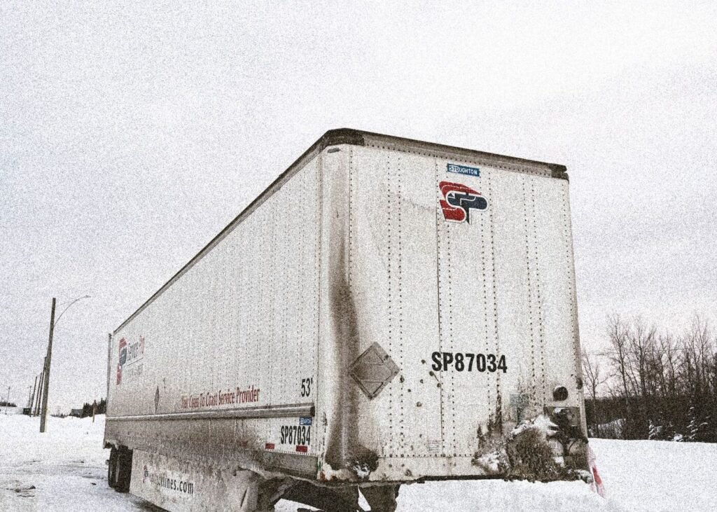 Shipping container in winter conditions awaiting customs clearance