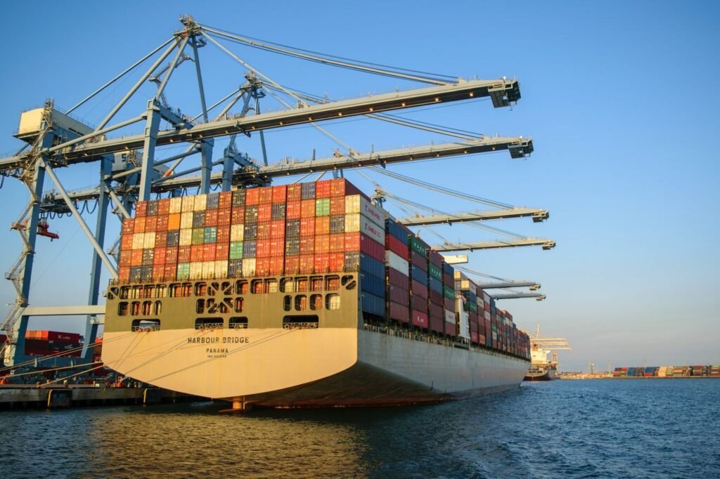 Cargo ship in harbour under a blue sky