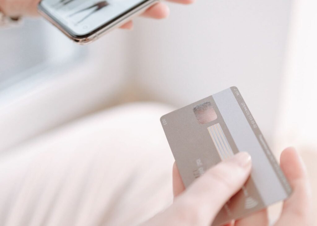 Shopper holding a payment card while buying online