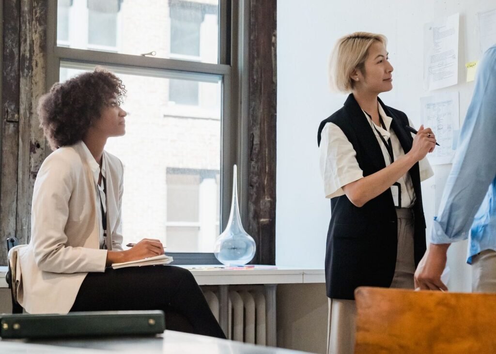 Colleagues cooperating in an office reviewing performance data