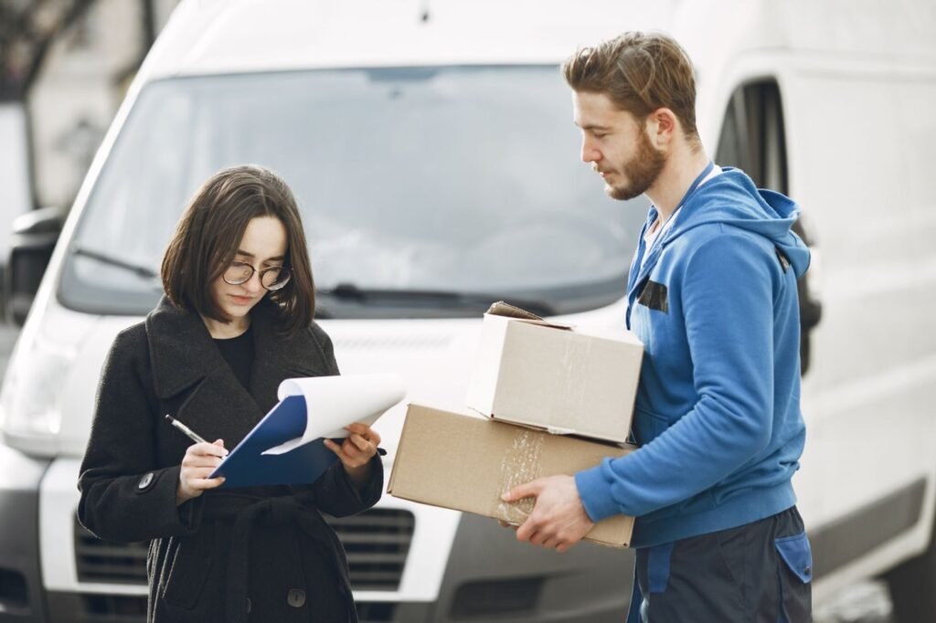 Courier delivering packages to a customer at home