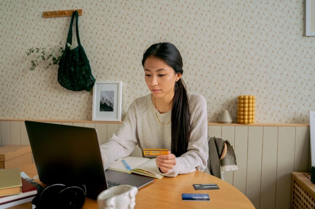 Shopper comparing products online at home on a laptop