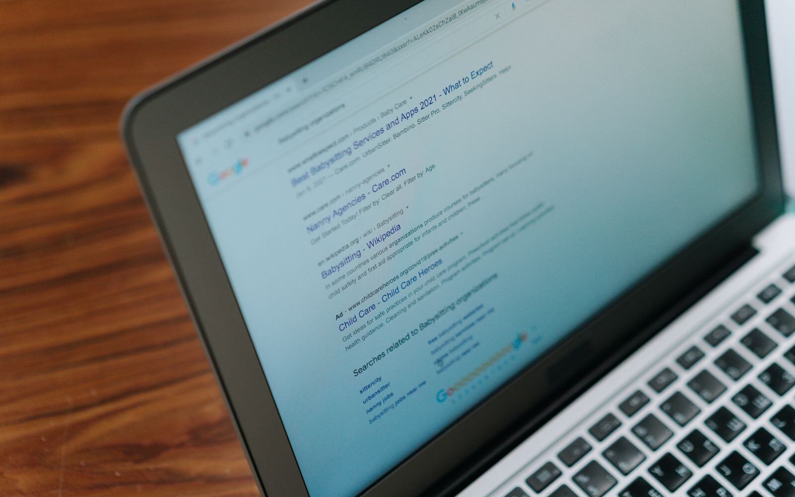 Laptop showing a search engine results page used to research category page demand