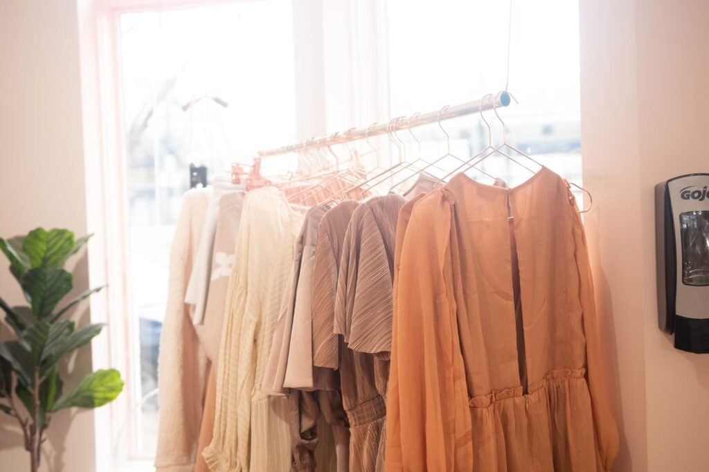 Collection of dresses on hangers in a boutique