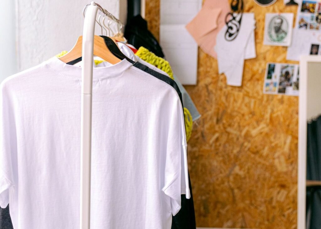 Fashion studio with a clothing rack and styled garments