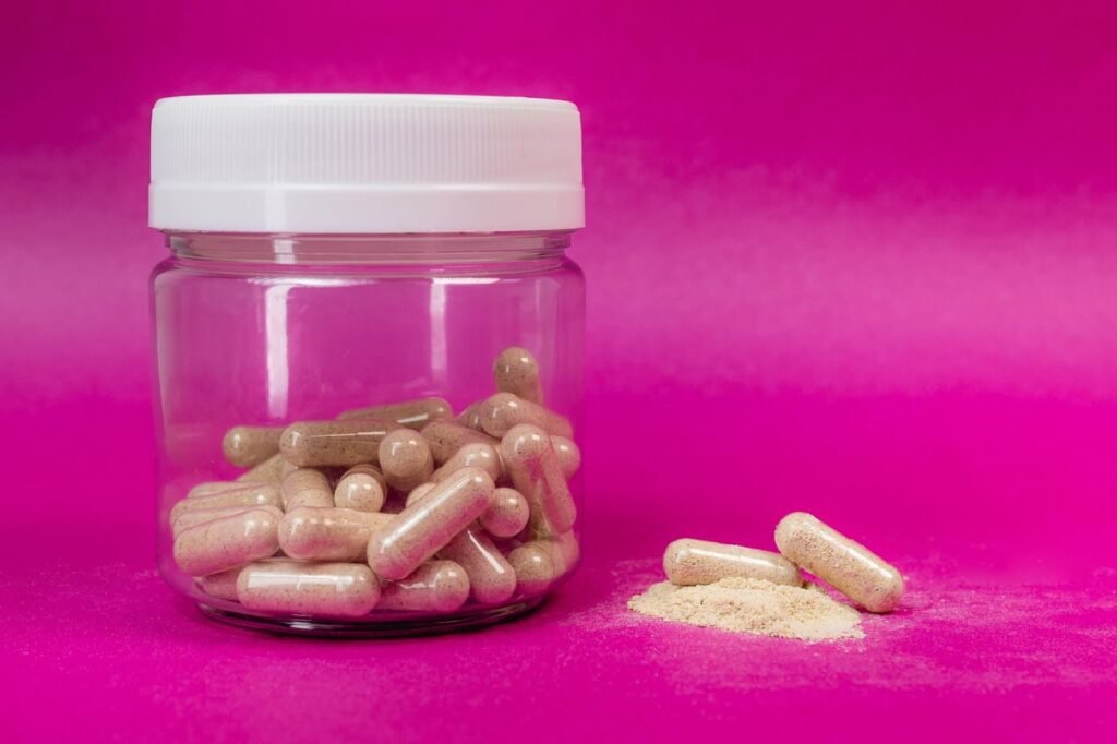Supplement capsules and powder arranged for product photography