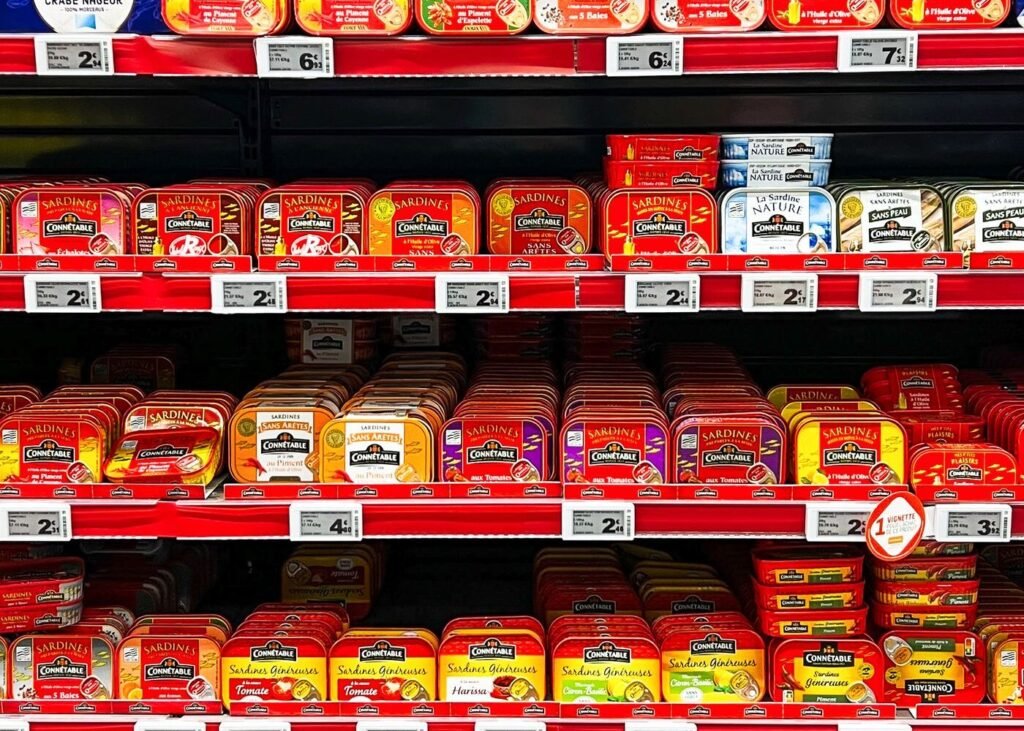 Colourful packaged goods displayed on supermarket shelving