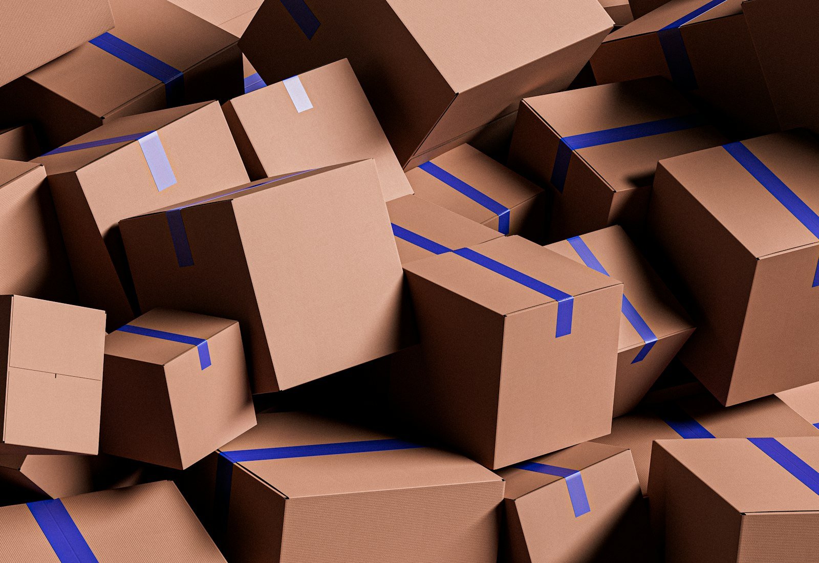 Pile of brown cardboard cartons taped for shipping