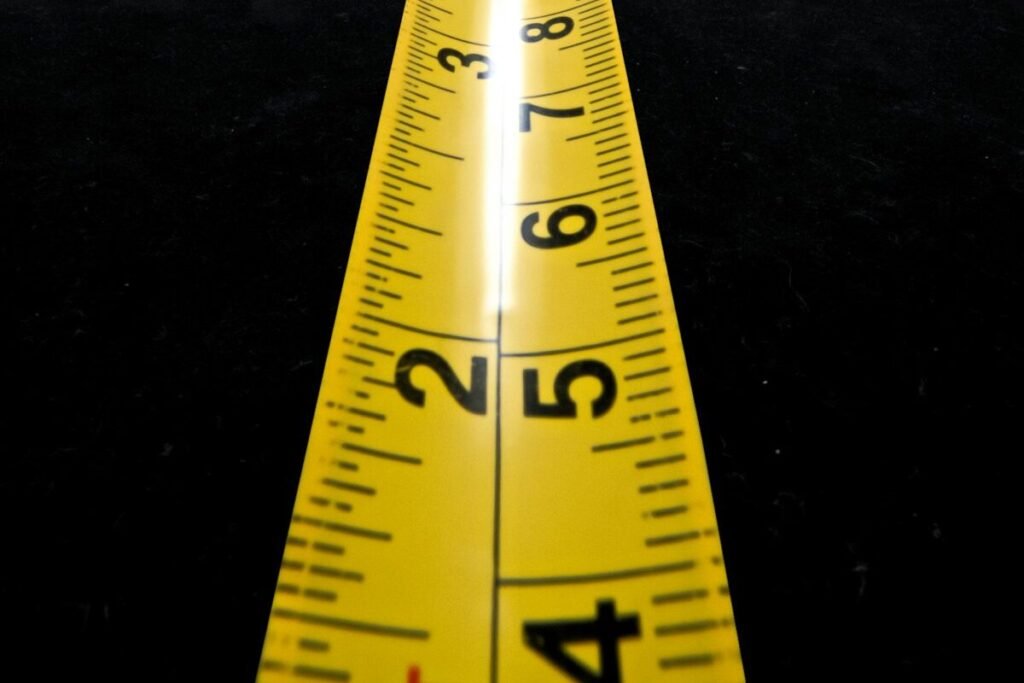 A yellow and black measuring tape