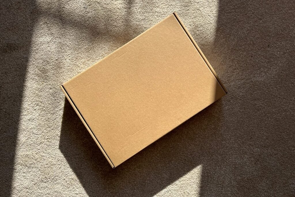A packaging box on a textured surface