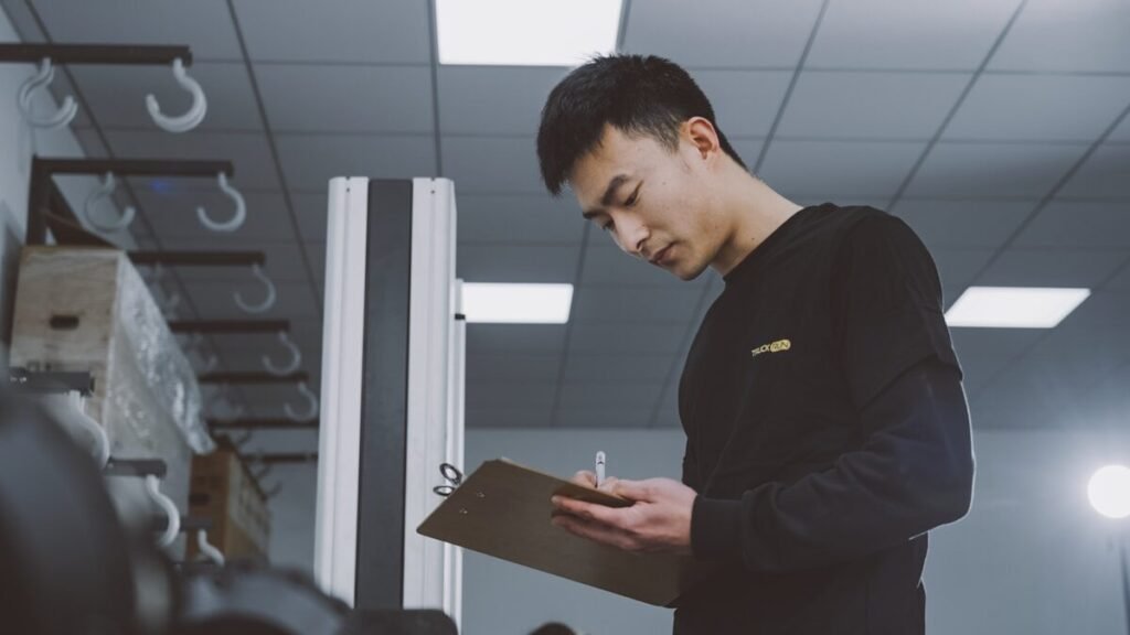 An inspector checking stock with a clipboard