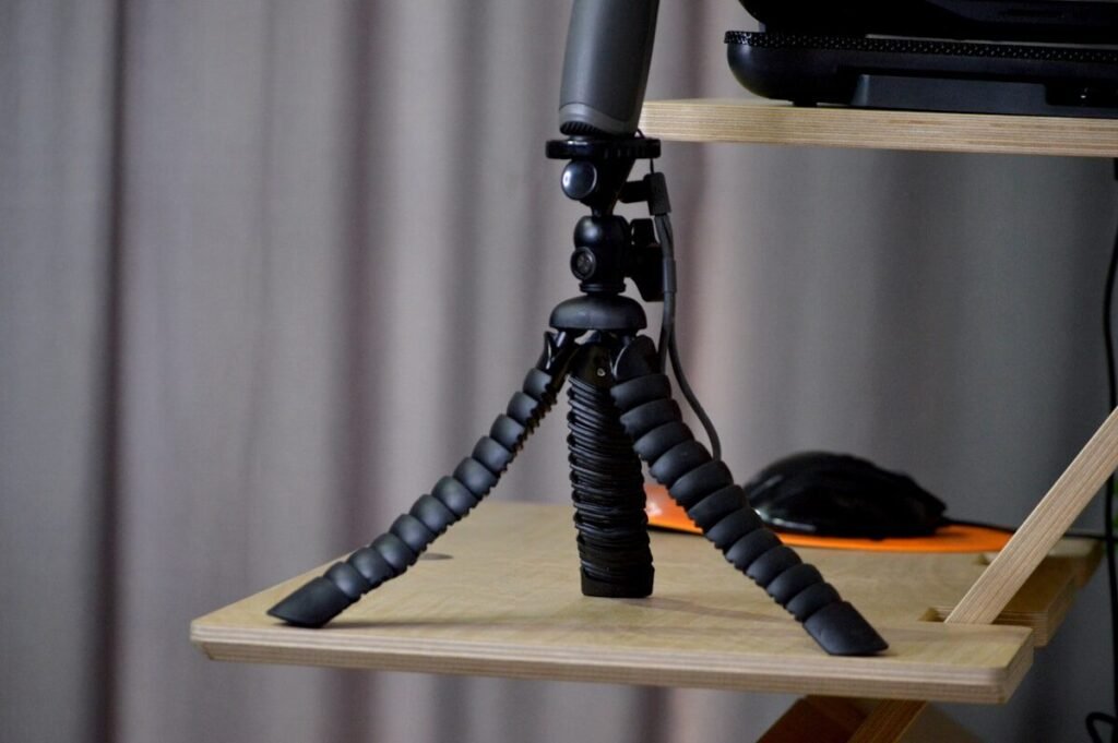 A tripod set up on a shelf