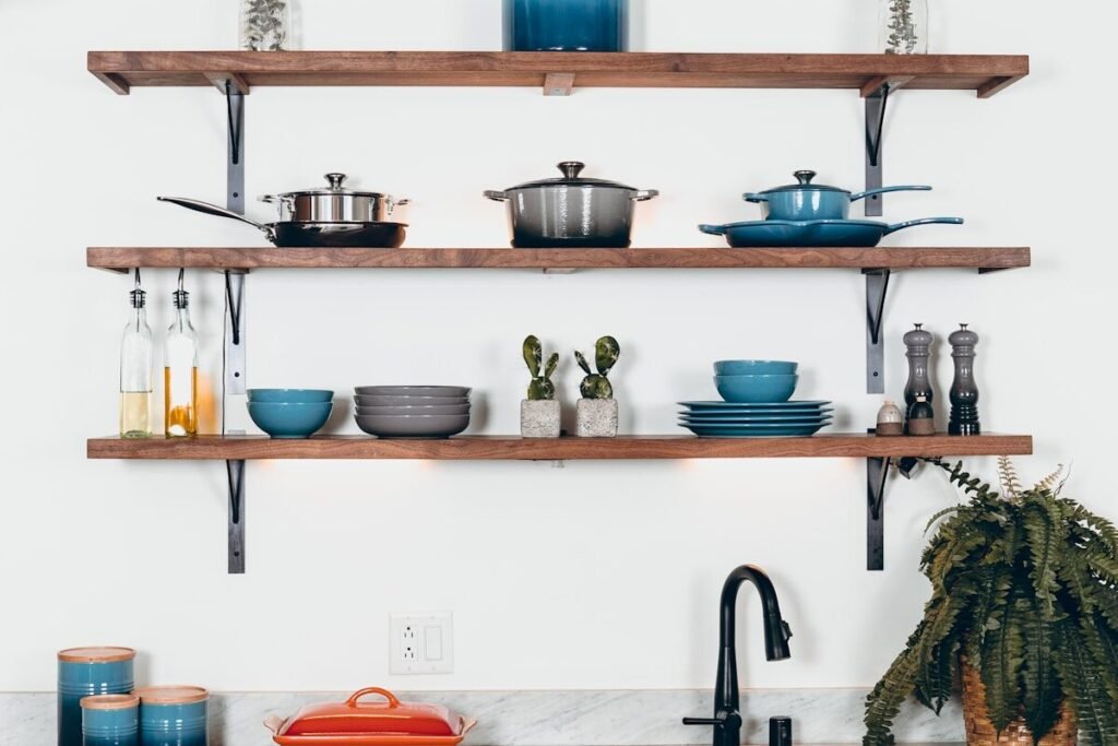 A cookware set arranged on floating shelves