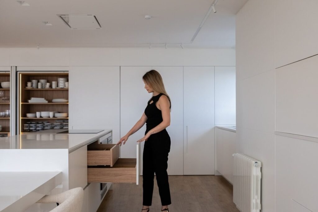 Opening a drawer of neatly organised homeware