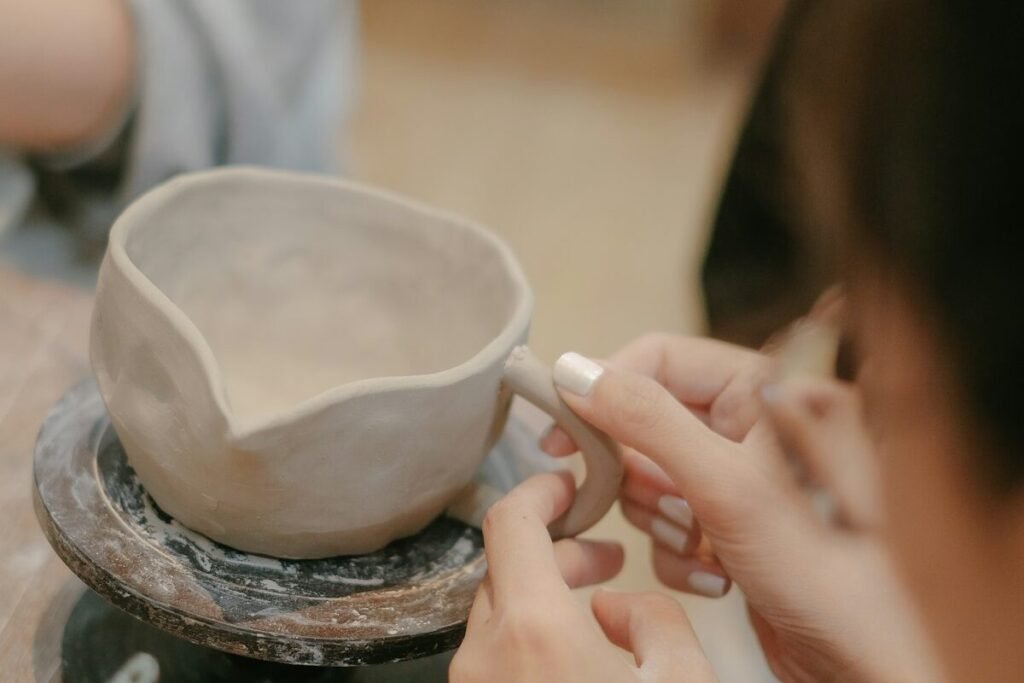 A craftsperson finishing a handmade bowl