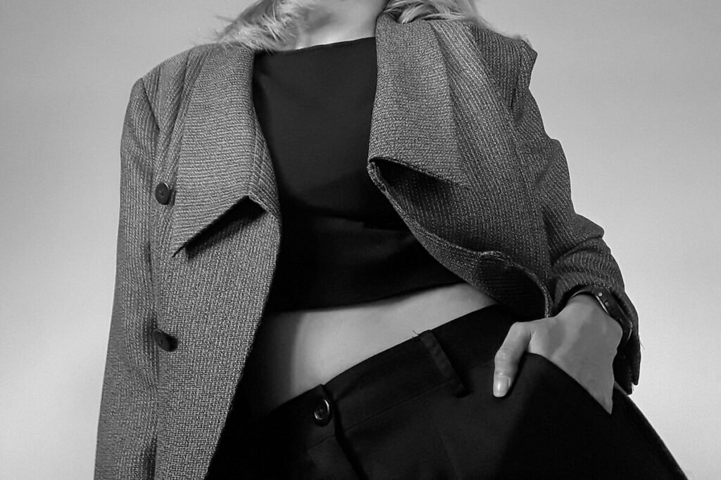 A model in a tailored blazer and trousers