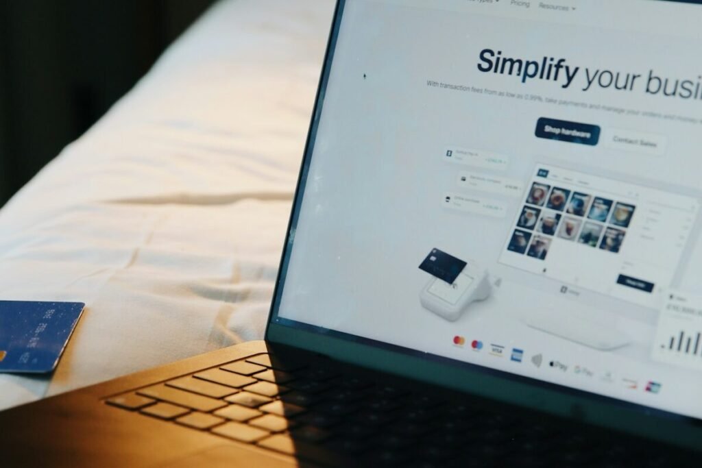 A laptop, phone and payment card together