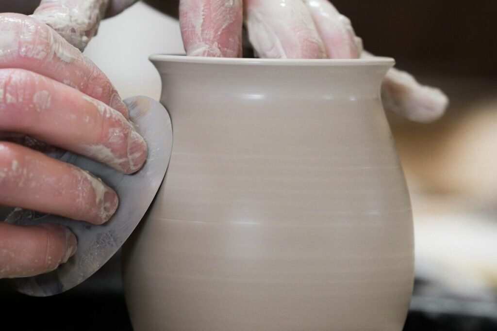 Holding a finished handmade pot