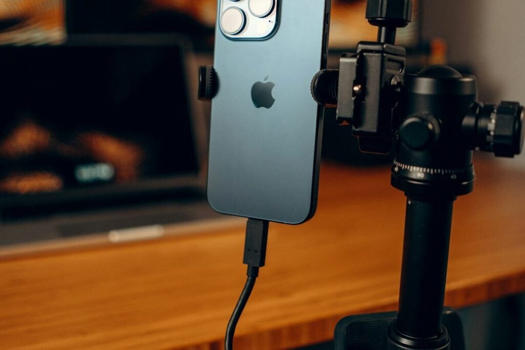 A phone mounted on a tripod for filming