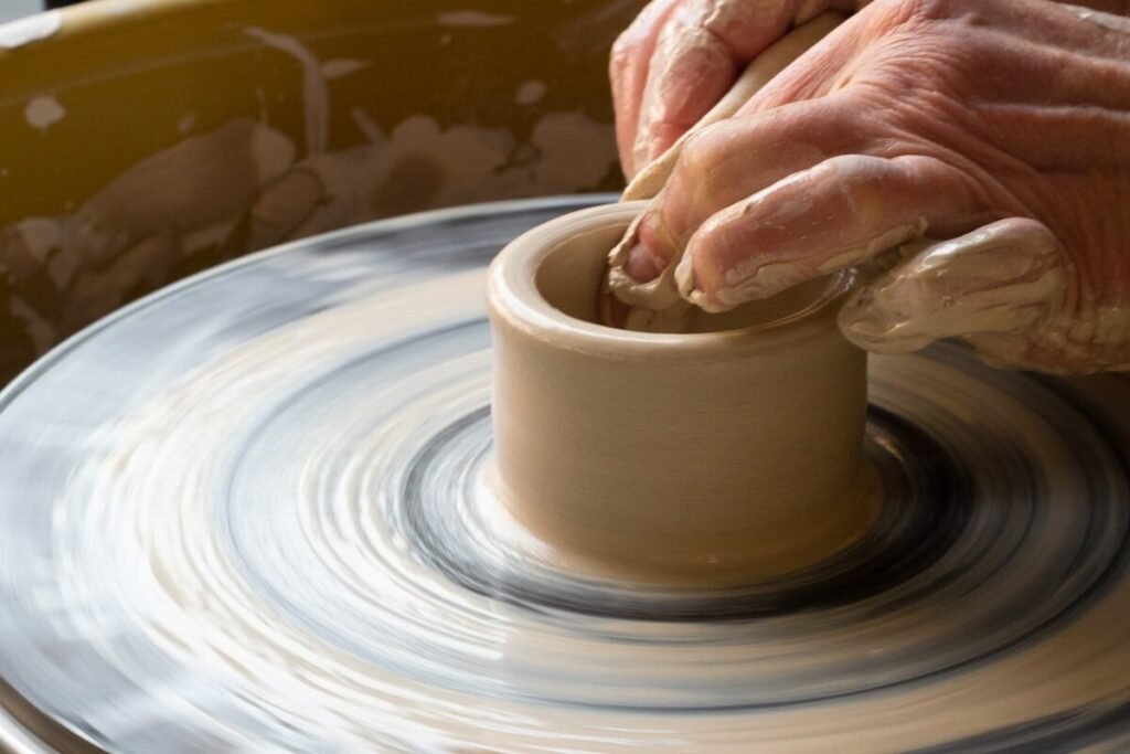 Hand-forming pottery in a workshop