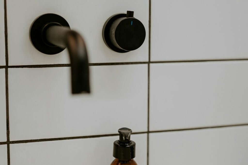 A beard balm bottle in a bathroom setting