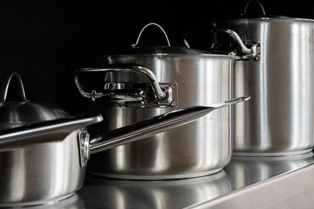 Steel cooking pots on a serving tray