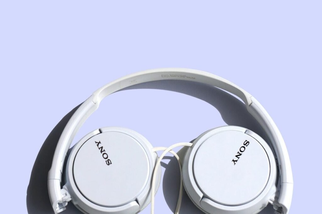 Corded headphones on a plain background