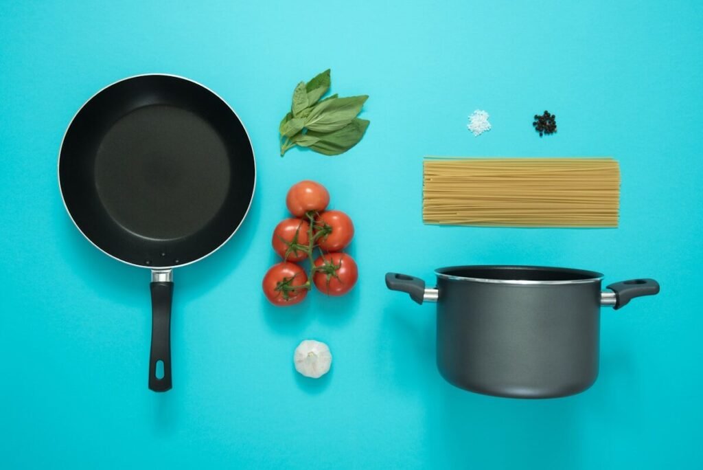 A frying pan photographed flat lay with tomatoes