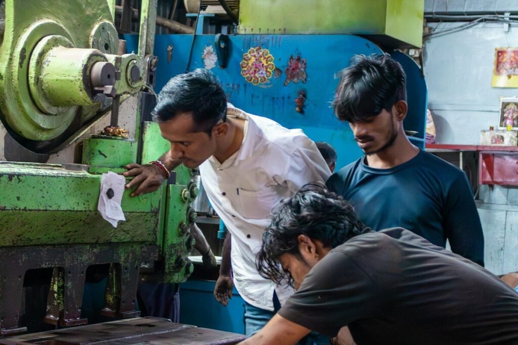 Workers operating a large industrial machine