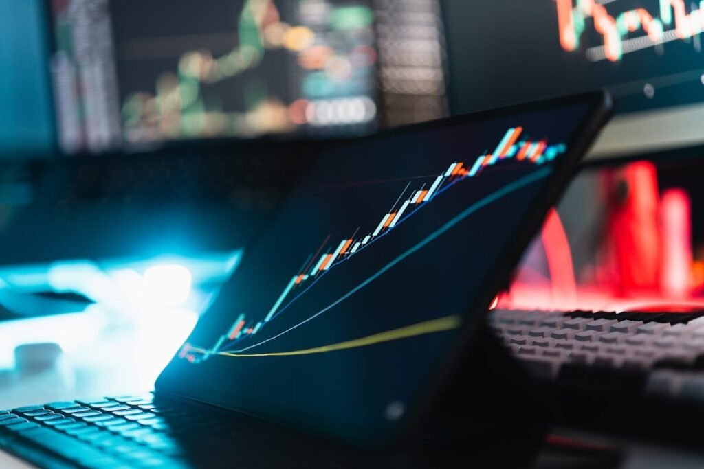 A tablet showing a rising performance graph