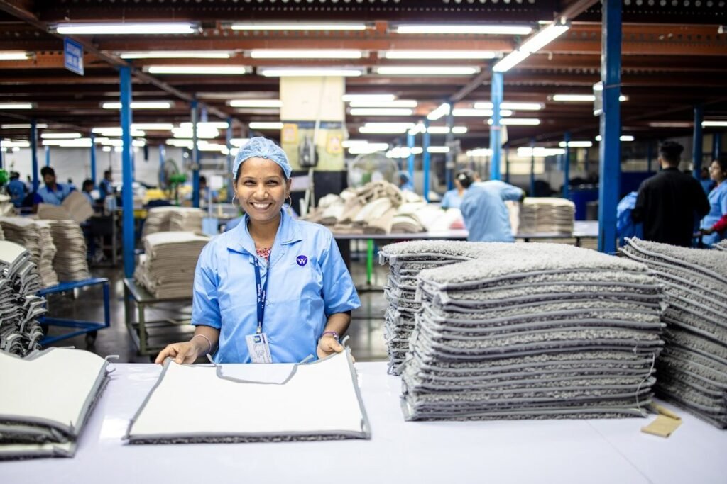 A worker in protective workwear on the factory floor