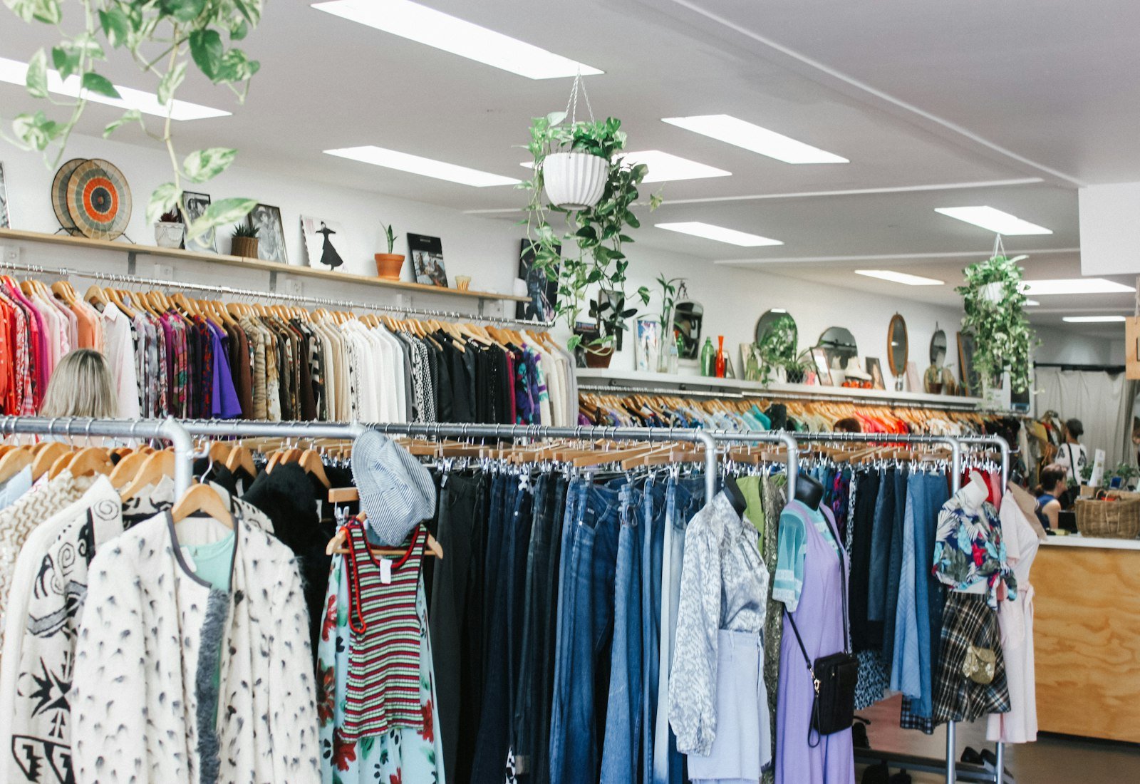 Rails of assorted clothing in a resale store