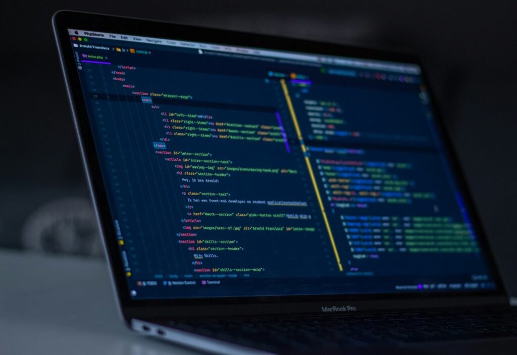 Developer editing code on a laptop screen