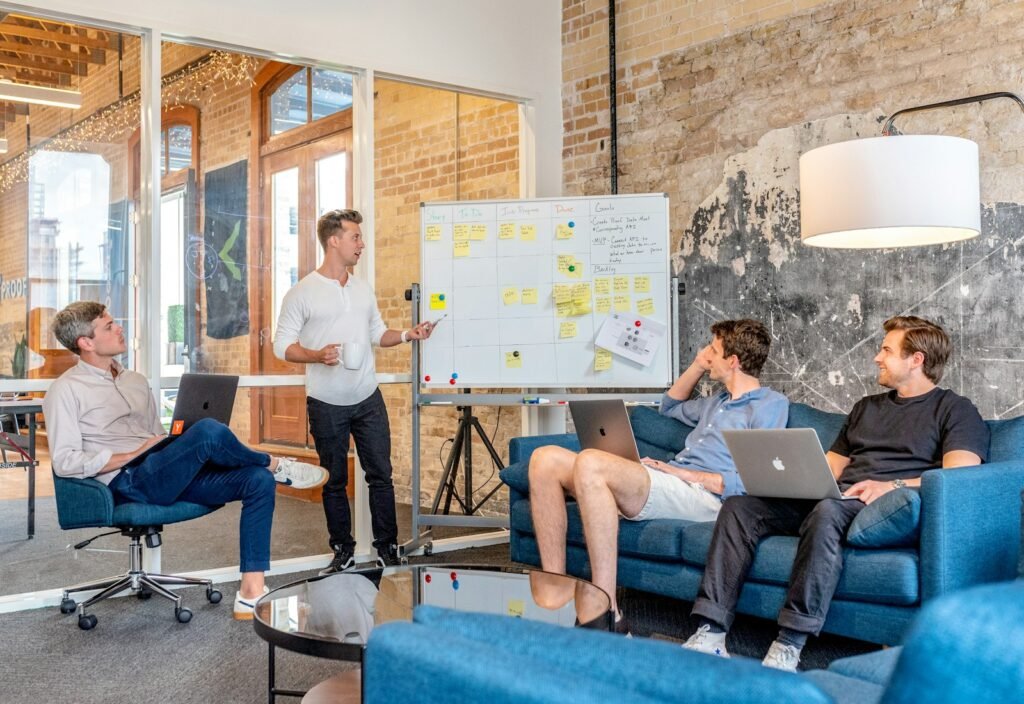 Marketing team reviewing strategy at a whiteboard